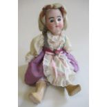 A French bisque socket head doll, with blue glass eyes, blonde wig, closed mouth, composition