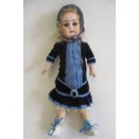 A Simon & Halbig bisque socket head doll, with blue glass sleeping eyes, open mouth with four