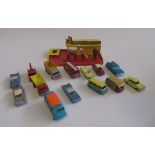 Unboxed Matchbox vehicles including Fire Engine, Cadillac, Vauxhall and plastic Matchbox garage,