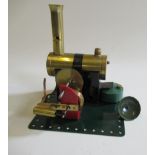 A Bowman spirit fired steam engine with single cylinder to geared drive, paint restoration, G (