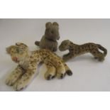 Two Steiff leopards, one recumbent, the other standing, together with a seated lion, largest 13"