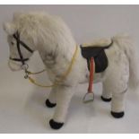 A Merrythought standing pony covered in white fur, late 20th century, with white/black eyes, leather