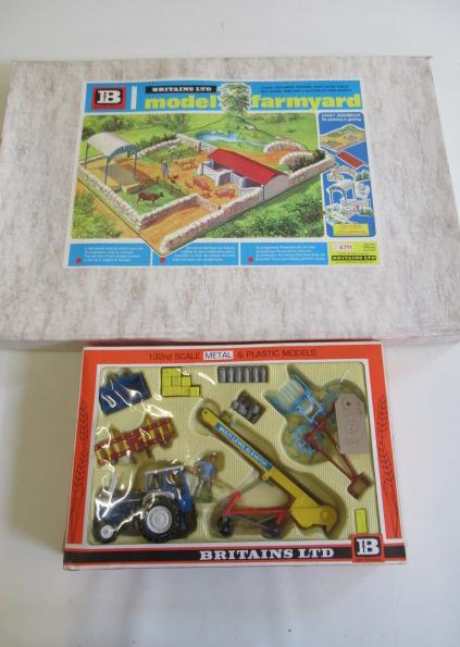 A Britains 4711 model farmyard, in original cardboard box, 25 1/2" x 17 1/2", together with a Farm