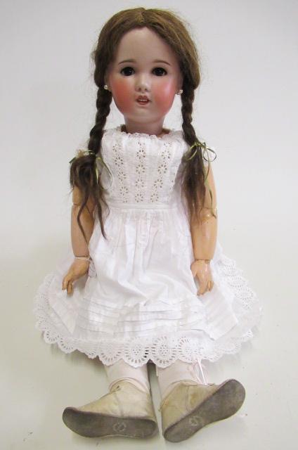 An S.F.B.J. bisque socket head doll from the Jumeau mould, brown sleeping glass eyes, open mouth