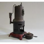 A German made small vertical steam engine with single cylinder and spirit fired boiler, missing