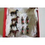 Four Britains 11th Hussars, dismounted from their horses, all items repainted, G (Est. plus 21%