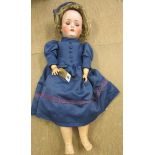 A Kestner bisque socket head doll with blue glass sleeping eyes, open mouth with moulded upper