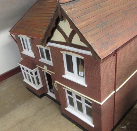 A doll's house, mid 20th century, painted wood construction with gabled roof, two storey three bayed - Image 2 of 2