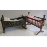 A doll's painted wood cradle, mid 20th century, with floral decoration and rockers, 22" long, two