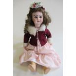 A DEP bisque socket head walking doll, with blue glass sleeping eyes, open mouth, four top teeth,