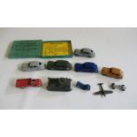 Ten early Dinky vehicles including Oldsmobile, Packard, Peugeot and Tank, and an empty box for