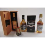 5 bottles of whisky comprising 1 35cl boxed 10 year old Glenmorangie, 1 70cl 5 year old Glayva, 1