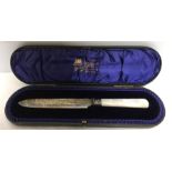 A cased silver bread knife with mother of pearl handle. Sheffield 1901.