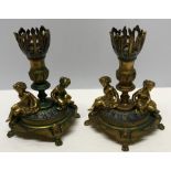 Pair of decorative brass candlesticks with enamel inlay and cherubs, 13cms h.