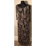 A 1920/30s black and gold silk sleeveless evening dress, some repair.