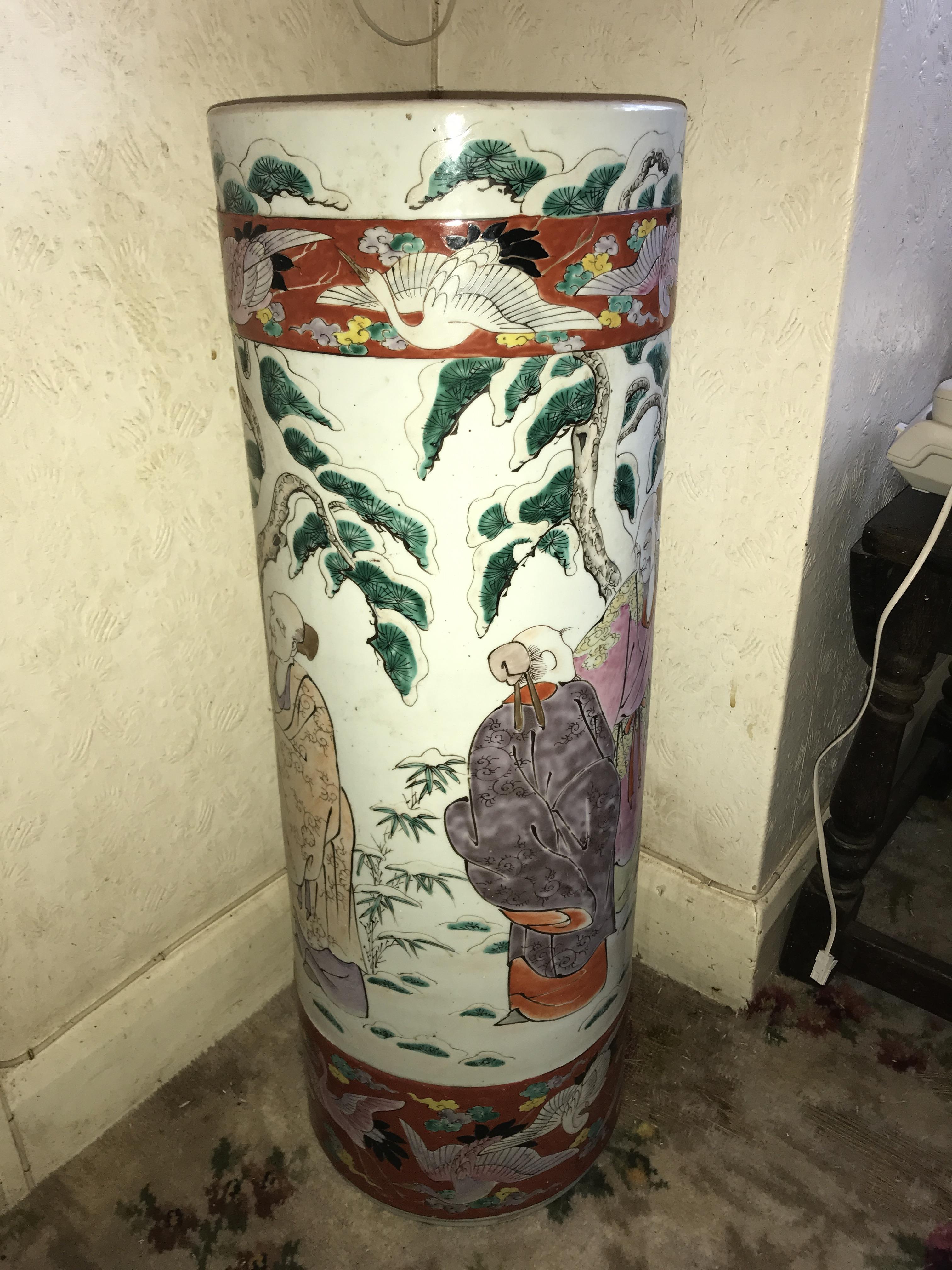 Chinese umbrella stand- 70cms h, 25cms d. Repair to side.