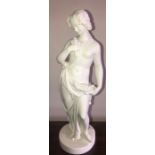 A Parian figure of a lady. Damage to toe. 38cms h.