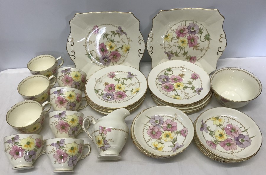 Tuscan china part tea set, floral pattern with gilt rims. 34 pieces.