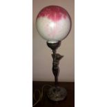 An Art Deco style table lamp after Moreau with glass ball. 46cms h.