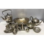 Selection of silver plated wares, spirit kettle, teapot, toastrack, candlesticks, baskets etc.