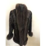 Shaved dark brown astrakhan 3/4 jacket with fox fur collar and cuffs. 14/16.