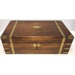 A 19thC rosewood and brass inlaid writing box with key and secret drawer with a variety of related