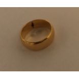 A yellow metal wedding band tests as 18 carat gold. 6.7gms.