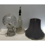 Two cut glass table lamps, 1 with globe shade.