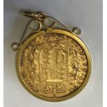 A Victorian shield back sovereign, 1869 in mount, total weight 9.4gms.