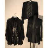 Three early 20thC black lace jackets, one with satin ribbon and tassels, one with frilled collar.