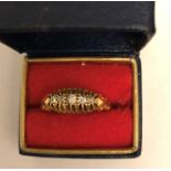 Eighteen carat gold ring set with 5 diamonds, 2.4gms total. Size N.