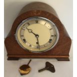 Oak cased Elliot mantle clock, Westminster chimes. 23cms h x 27cms w.