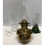 James and Wills hanging brass oil lamp with spare chimney and a green portable oil lamp.