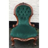 A good quality 19thC carved walnut nursing chair with button back up upholstery casters.