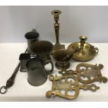 A miscellany of 19thC metalware including pewter tankards, one with glass base, pestle and mortar,
