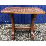Gnomeman oak hall table with a carved top. 72cms h x 76cms w x 45cms d.