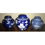Three various Chinese blue and white ginger jars, all with lids. 15cms tallest.