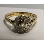 An 18 carat gold and diamond set ring. 3.9gms.