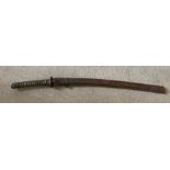 A Japanese war sword with text under the handle. Condition ReportLeather outer sheaf with wear to