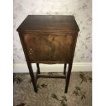 A reproduction bedside table. 76 h x 37 w x 28cms d
