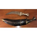 Kukri knife with another knife with wooden and white metal handle.