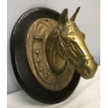 Wall mounted brass horse head and shoe wooden backplate. 30cms h x 24cms w.