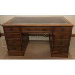 A good quality burr walnut/pedestal desk with tooled leather top. 137 x 69 d x 79cms h.