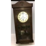 Oak cased wall clock. 79cms h.