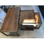 Three mid century teak coffee tables with nest of two matching tables.
