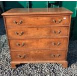A 19thC oak 4 height chest of drawers on bracket feet with brass drop handles.