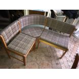 A mid century three seater corner seat with lift up seat for storage.