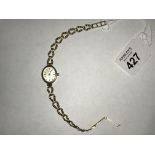 Ladies 9 ct gold wristwatch marked Geneve, gold to face. 8.5gms total.