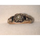 A 19thC yellow metal, enamel and pearl mourning ring, size J, 1.9gms. some loss to enamel.