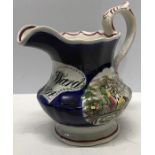 Jug commemorating the Great Exhibition 1851, Ann Ward 1854 to front, handle repaired. 16cms h.